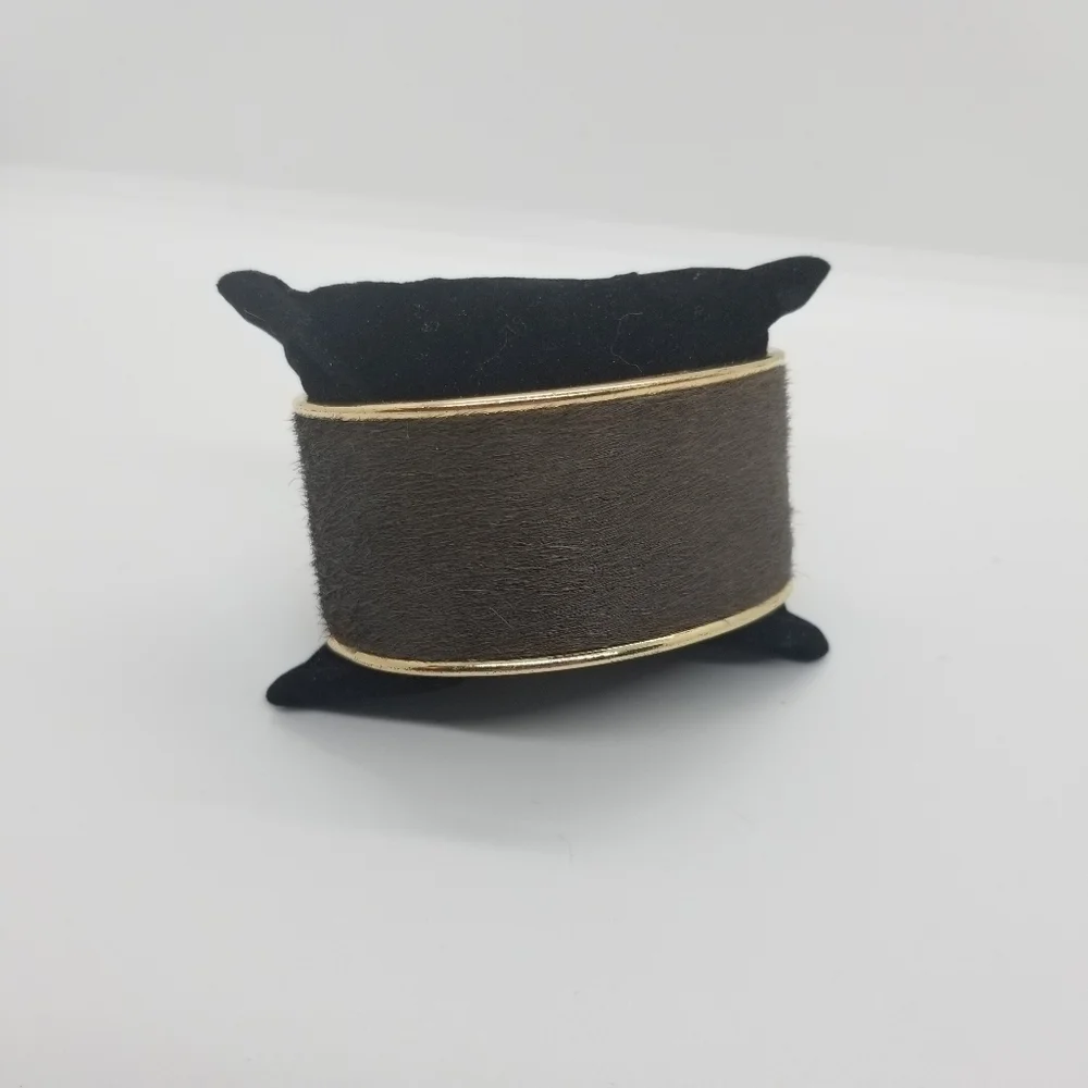 gold tone cuff bracelet with brown hair inset